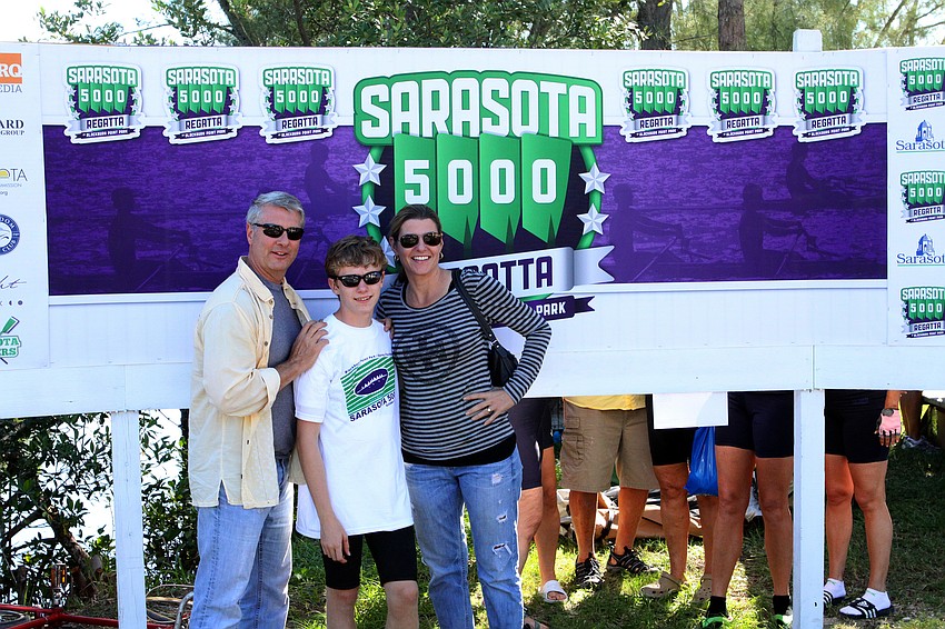 Tom, Hugh and Elaine Jenkins pose for a family photo Sunday, Oct. 2 during the Sarasota 5000 Regatta out at Blackburn Point Park.