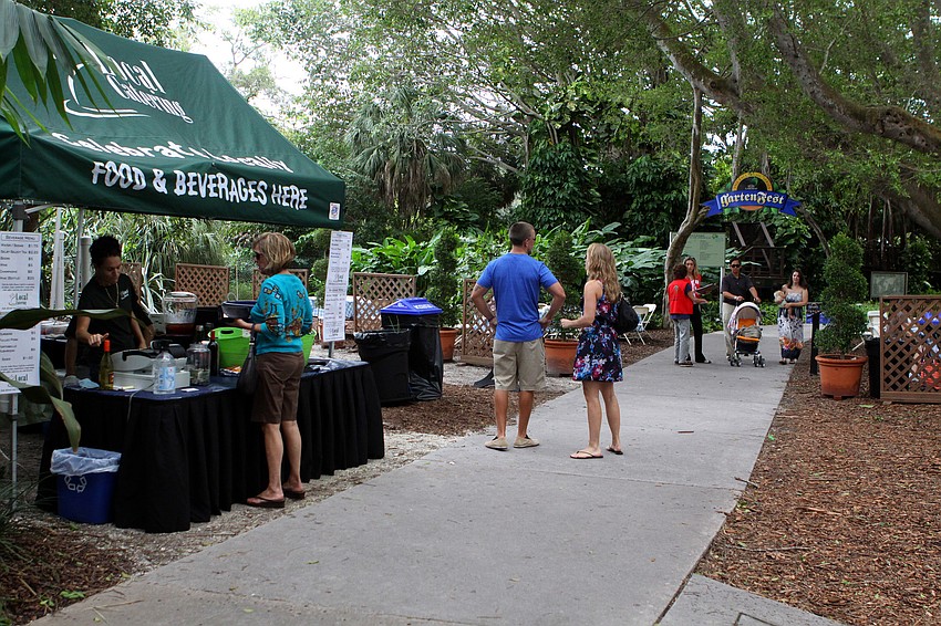 People walk through the gardens and get food and drinks Sunday, Oct. 9 during GartenFest at Marie Selby Botanical Gardens.