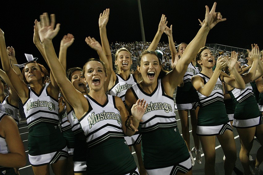 Cheerleaders erupted into jubilation as the Mustangs scored a touchdown with just seconds remaining in the first half.