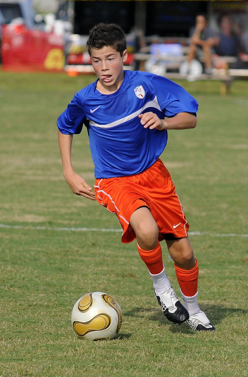 Jonah Thiele, 13, brings the ball up the field during the Gainesville Soccer Allianceâ€™s first game of the tournament.