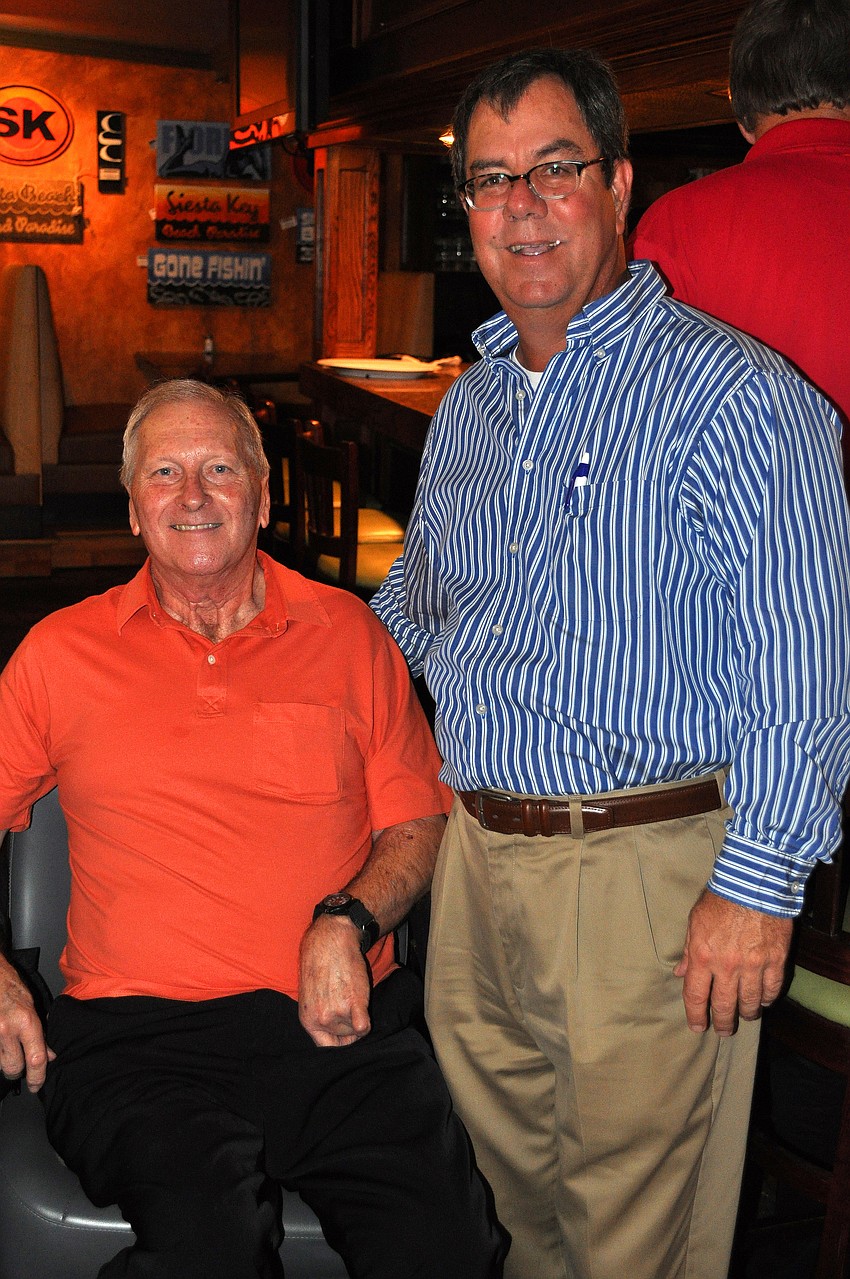 Clint Chapman poses with Clayton Thompson, the owner of Claytonâ€™s Siesta Grille Tuesday, Sept. 6 during the YES luncheon at Claytonâ€™s Siesta Grille on Siesta Key.