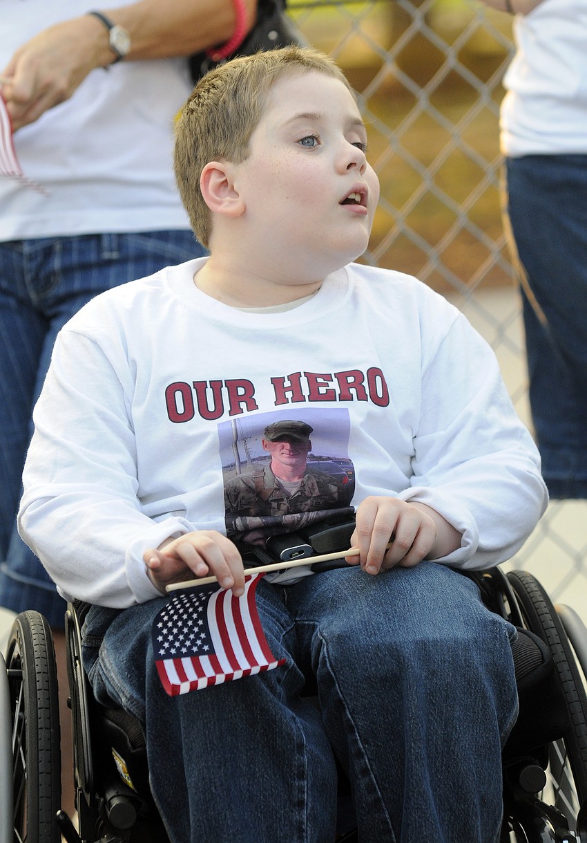 Seven-year-old Anthony Eason proudly wears a T-shirt in honor of his cousin U.S. Army Spc. 4 Patrick Lay II.