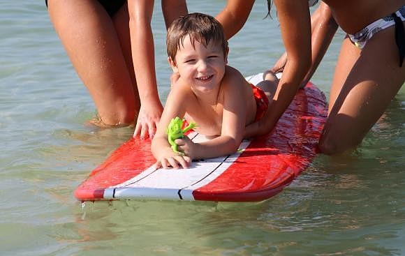 SIESTA KEY: Ethan Rizzuto, 4, gets ready to ride another wave.