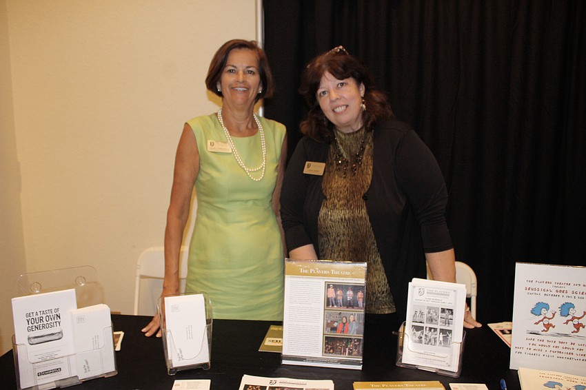 Nancy Arbuckle poses with Linda Darby at The Players booth.