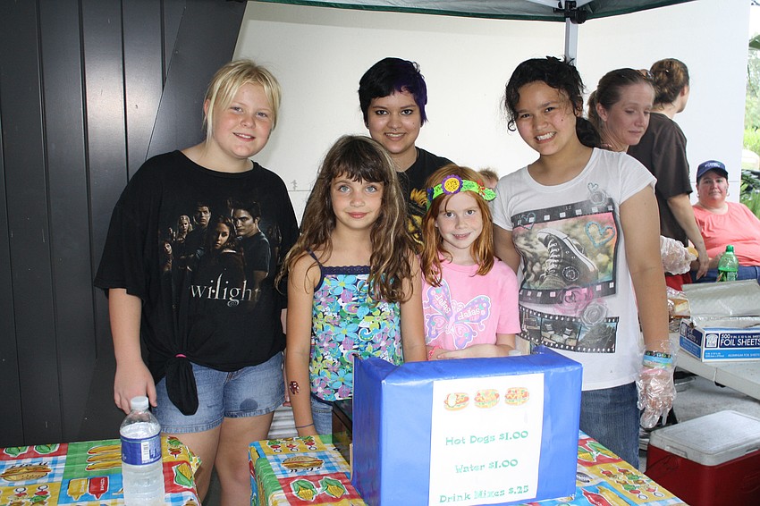 Dayna Forrester, Felicia Cortes and Vanessa Cortes (back) are in troop 81.  Troop 81 sells food with new troop 10, Joline Wilson and Nichole Barber.  The money raised is to help start the new troop.