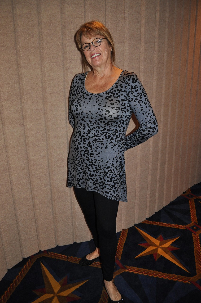 Patti Lowe wearing Soma Intimatesâ€™ Vintage Chic Miranda Long Sleeve Tunic Top in animal print and Perfect Waist Legging in black.