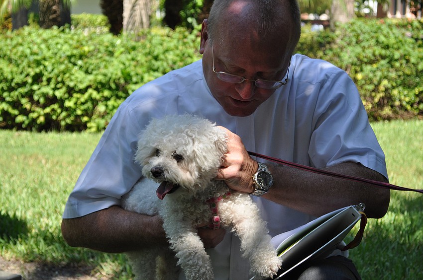Rev. Bernthal blesses Snowy.