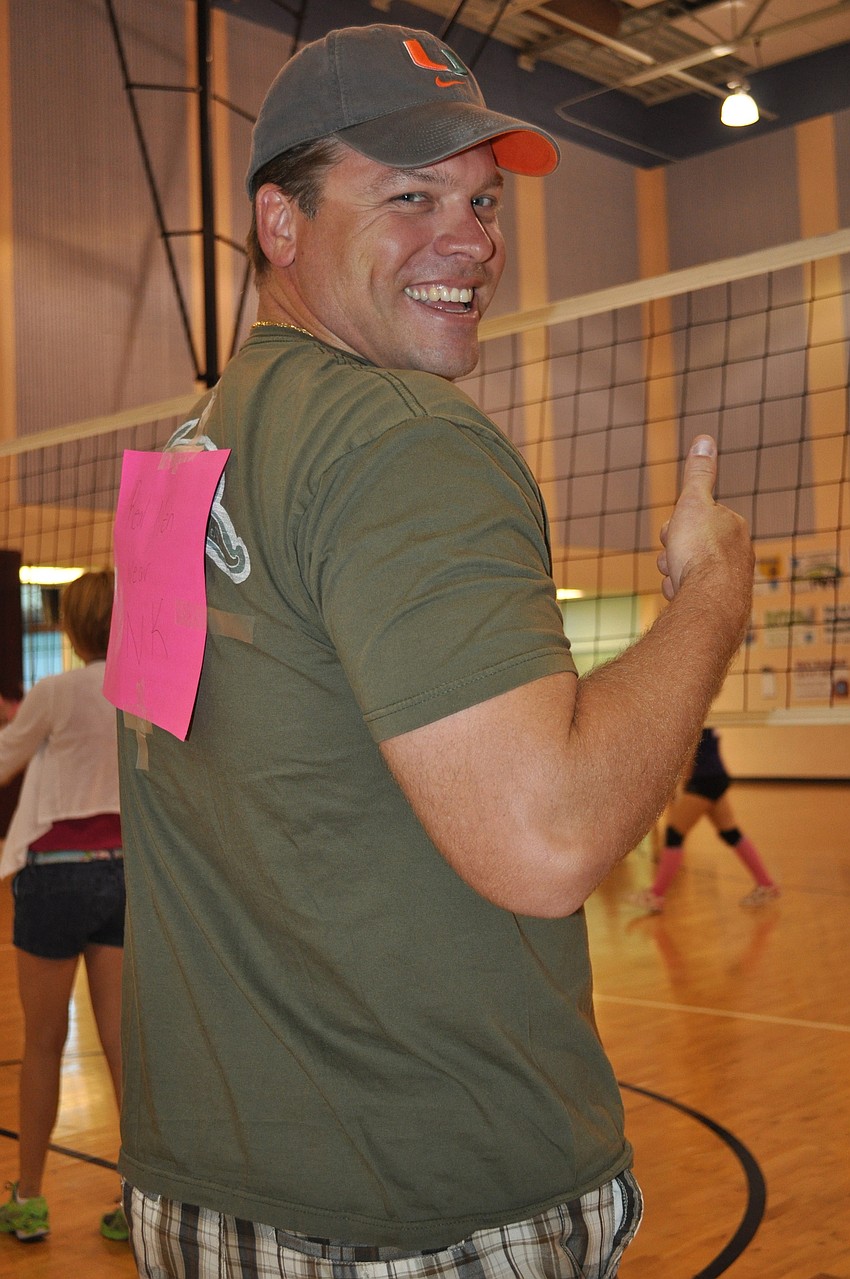 Maurice Opstal gives a thumbs up for the piece of paper on his back that reads 