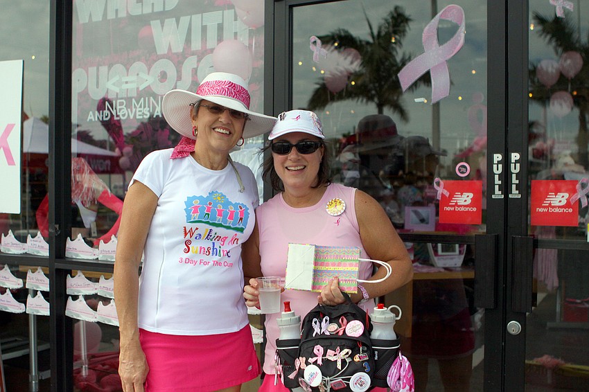 Six-time walker, Tina Borres and eight-time walker Sandy Kazinski pose outside of New Balance Sarasota.