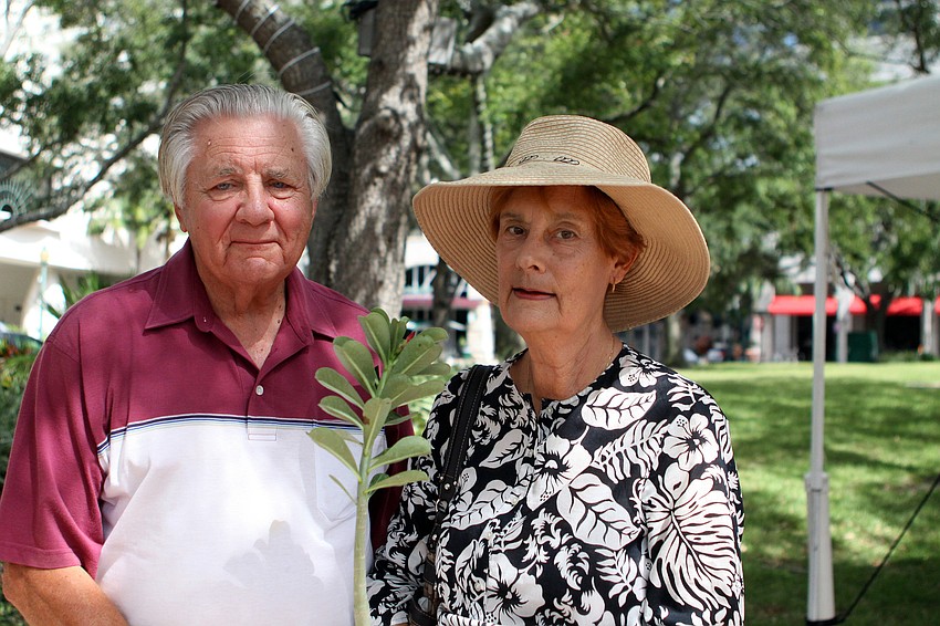 Matt and Pat Gresko show off their newly purchased red dessert rose.