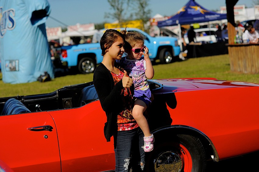 Fifteen-year-old Amber Bixby checked out the car show with her younger sister, Cheyenne, 2.