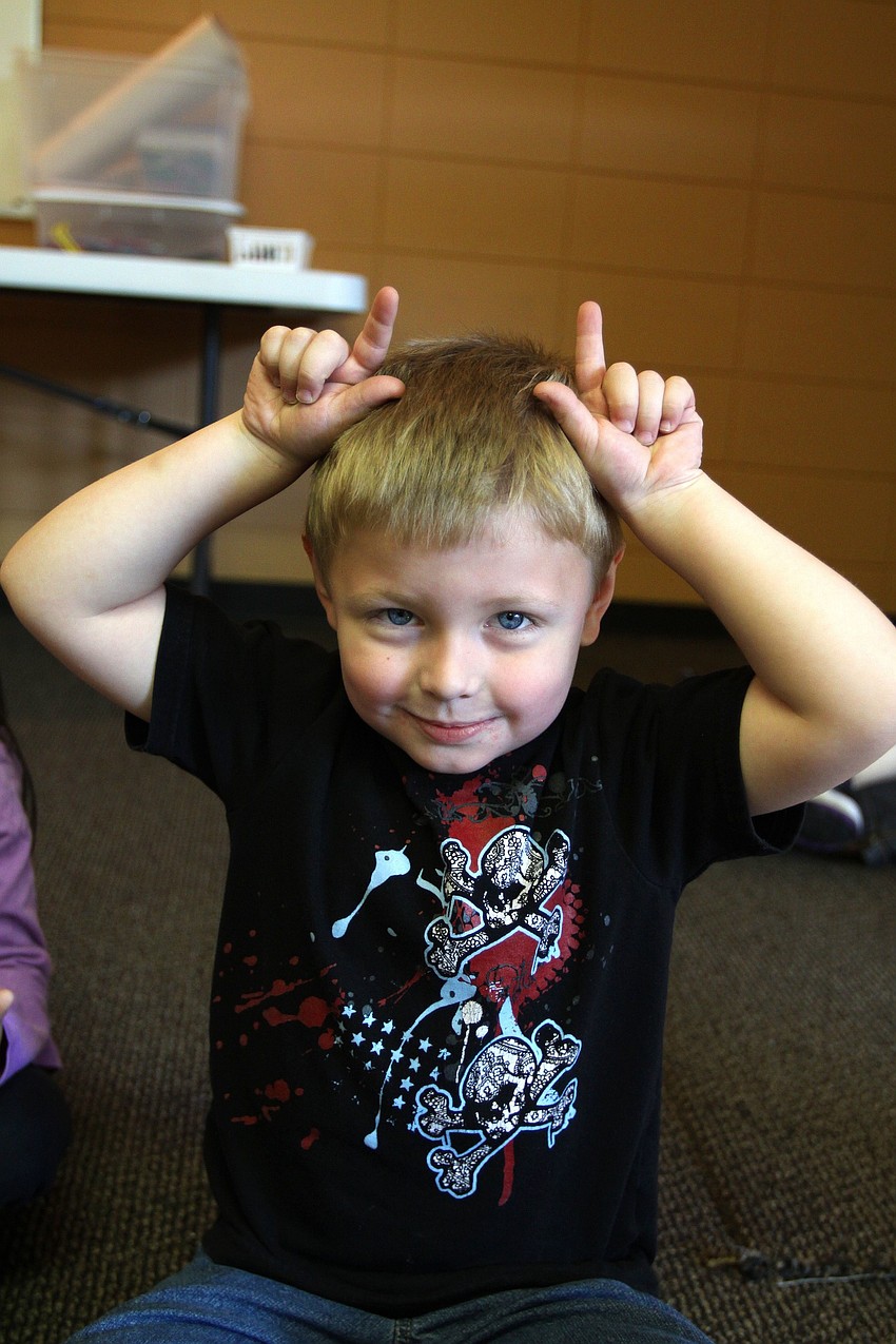 Logan Lutz does his best impression of bug antennae, Tuesday, Oct. 25, at St. Boniface Preschool.