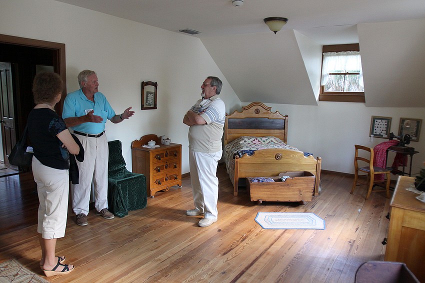 Docent Ed Orr, center, talks to Sandy Walker and Terry Greenwood about the Bidwell-Wood House.