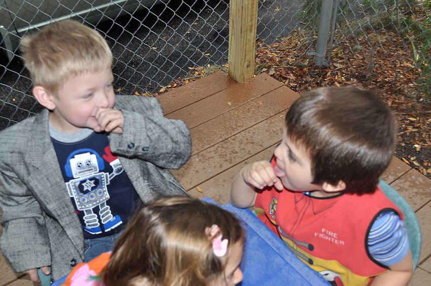 Logan Lutz and Liam Lizotte fine dine on pretend Mac and Cheese.