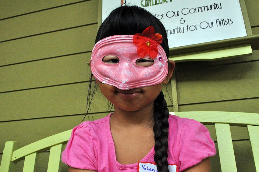 Valeria Boxley, 7, wears her mask, Saturday, Oct. 29, during Family Mask Day at Artists on the Court.