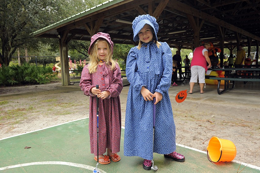 Five-year-old Audry Muller and her older sister Emery dressed up as pioneer girls.