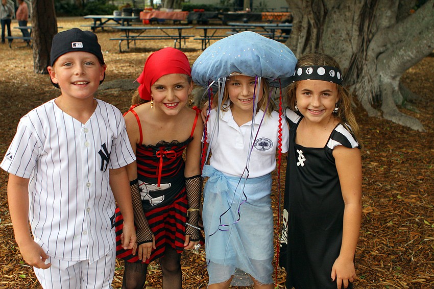 Schaffer Clatt, Elle LaClair, Brooke Collins and Angelina Spina, 9, all wore their Halloween costumes, Monday, Oct. 31, at Out-of-Door Academy.
