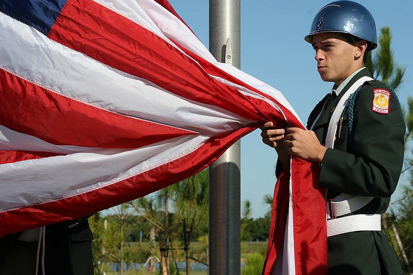 Lakewood Ranch JROTC's Shayne Williams helped raise the American flag at the park for the first time.
