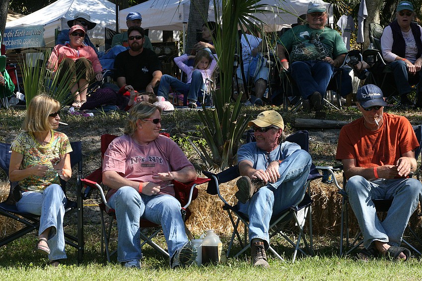 Some festival-goers joined the performing bands by playing the spoons.