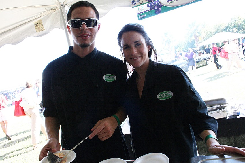 Chris Casey and Shauna Leary served a shrimp dish at MacAllisters Restaurant's booth.