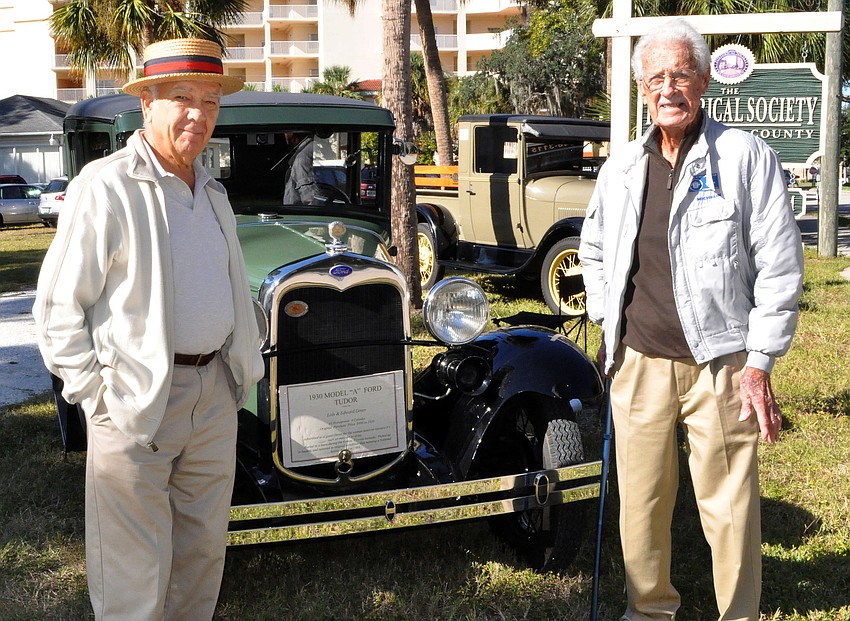 Milton Rauch and Edward Greer brought their historical cars out to Pioneer Day. The two men stand in front of Greer's 1930 Model 