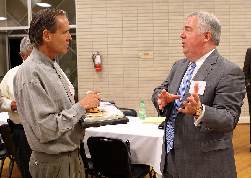 Mike Lasche chats with James Baker prior to the Q&A portion of the 
