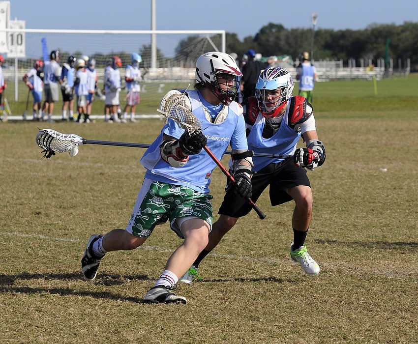 Ninth-grader Jared Snyder of Baltimore, Md., left, looks to get past sophomore defender Lazarus Chavez of New York.