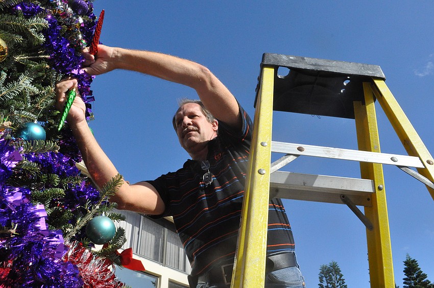 Assistant Mangaer Mark Meador gets the out-of-reach places