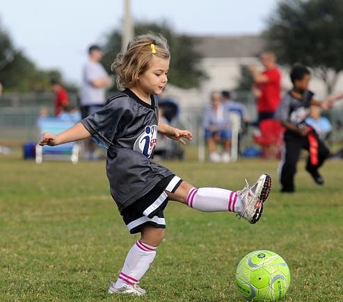 Four-year-old Isabel Neeb played in every game of her first soccer season. Photo by Jen Blanco.