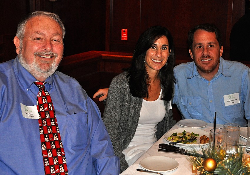 Jack Dean poses with Christine and Mark Tuchman at the Siesta Key Chamber holiday luncheon.