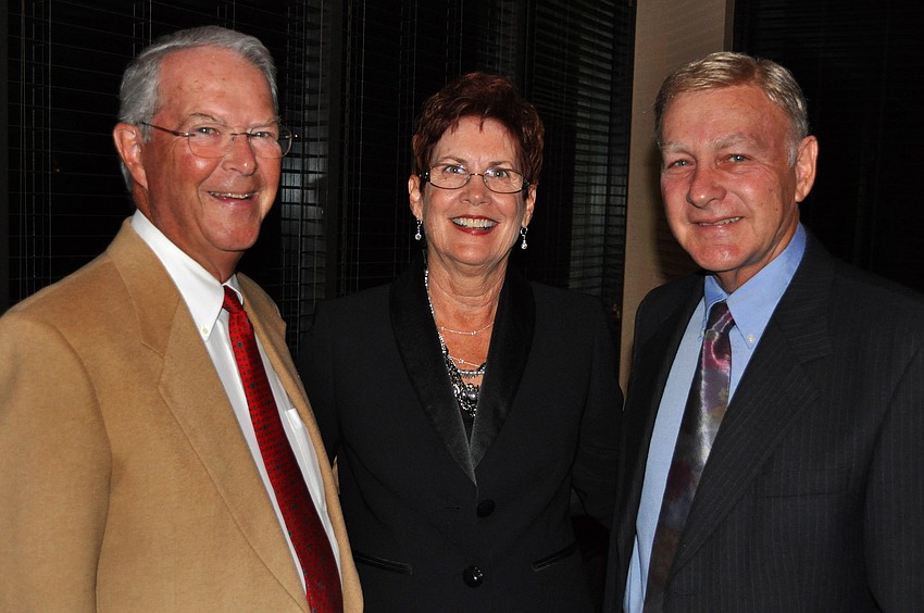 Jim Roche poses with Kathy and Mike Marcus during the St. Michael the Archangel annual Christmas Gala, Saturday, Dec. 3 at TCP Prestancia Country Club.
