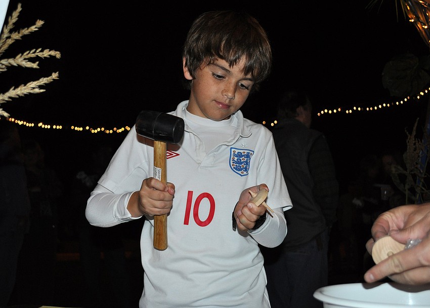 Ten-year-old Alex Thompson stopped by one of the merchants and made a spinning top.