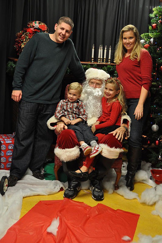 Greg and Jennifer Poznanski made sure to let their children, Evan and Ashlynn, see Santa.
