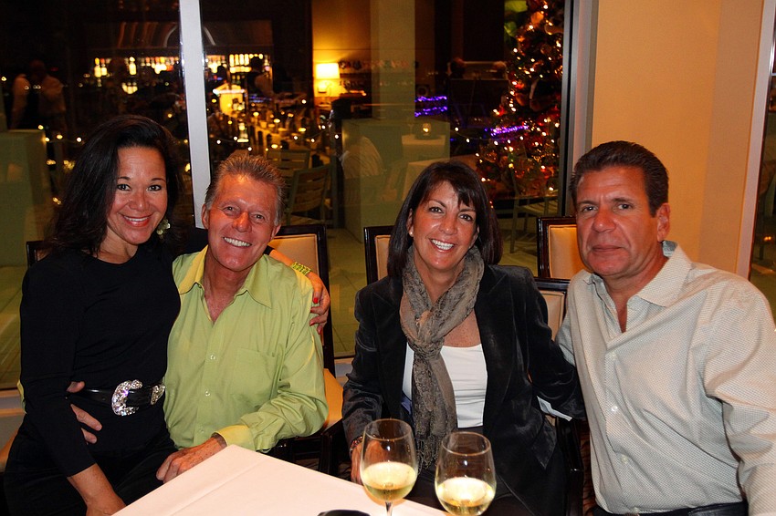 Sandra and George Ceshker pose with Janine and Dorian Irizarry.
