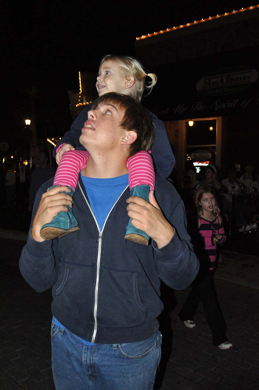 Jacob Elder, 17, and his two-year-old niece Chloe made sure to get a front row seat for the tree lighting ceremony.