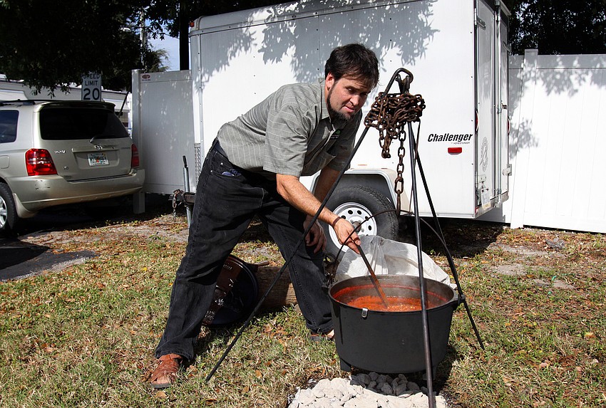 Urie Detweiler makes chili for people to enjoy along with their pieces of pie, Friday, Dec. 9 at Everence Federal Credit Union.