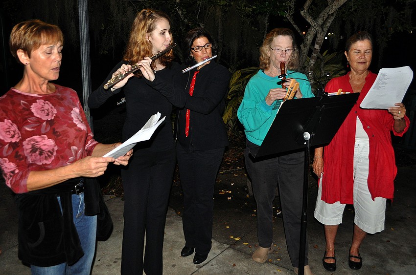 Suzy Hagglund, Amelia Risner, Jane Hoffman, Nancy Richardson and Kasy Kane led the crowd in the singing of Christmas carols, Sunday, Dec. 11, during the Laurel Park Holiday Party at Laurel Park.