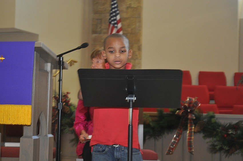 Kendrick Sailes reads a passage from Luke