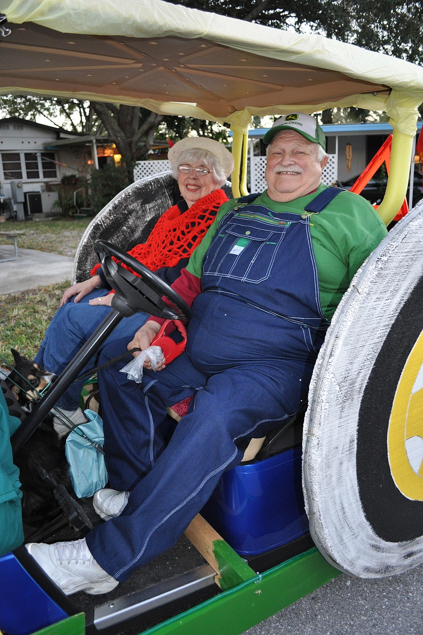 Barbara and Dave Engle paid tribute to their Indiana heritage with their John Deere float.
