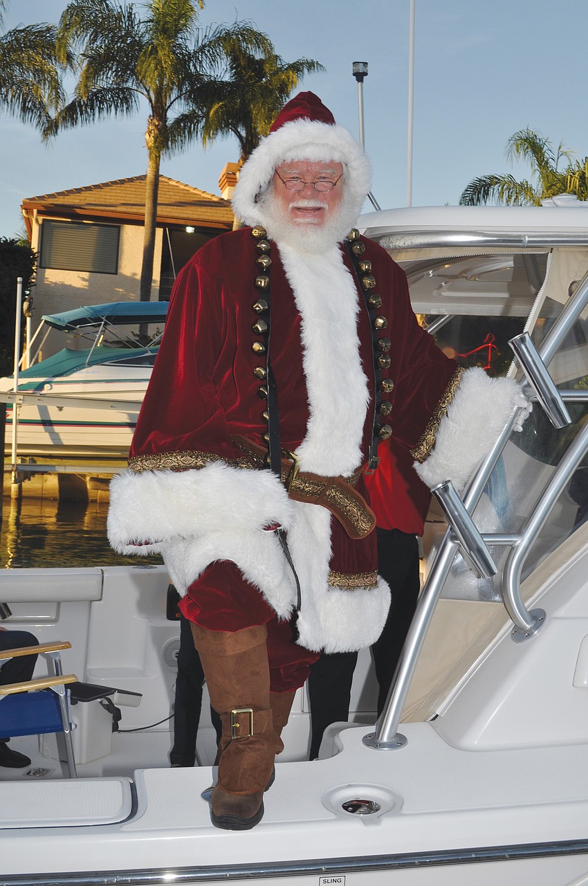 Santa Claus visited Bird Key Yacht Club in style â€” via boat â€” for the clubâ€™s December Christmas party.