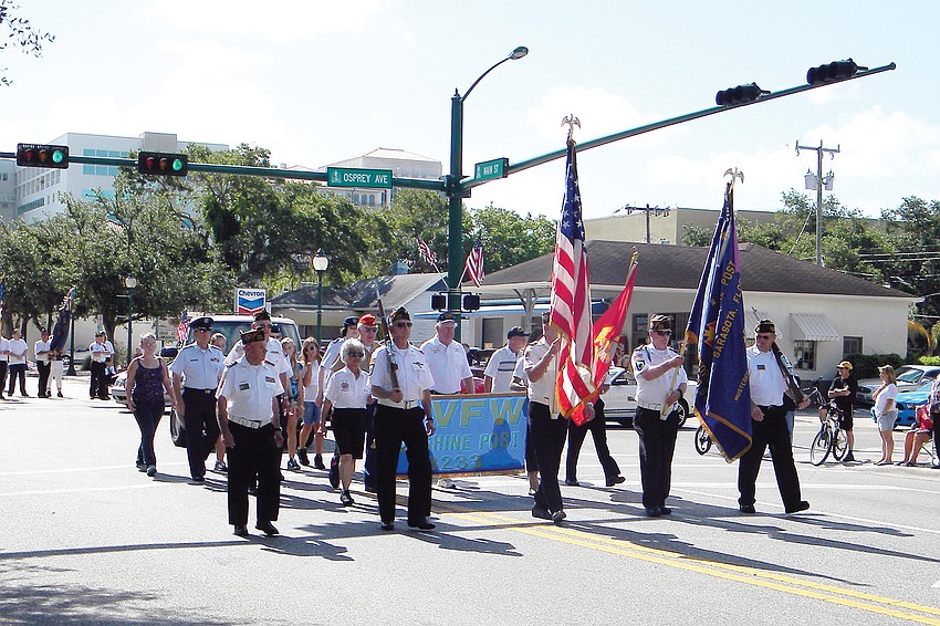 A Veterans of Foreign Wars group makes its way down Main Street in the Memorial Day Parade.