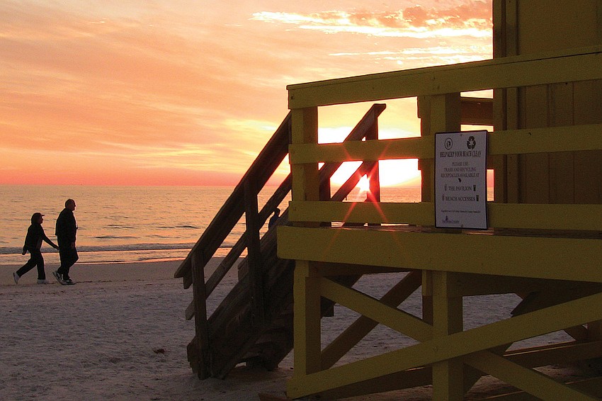 â€˜SOME ENCHANTED EVENINGâ€™: Robin Draper shot this romantic stroll on the Siesta beach.