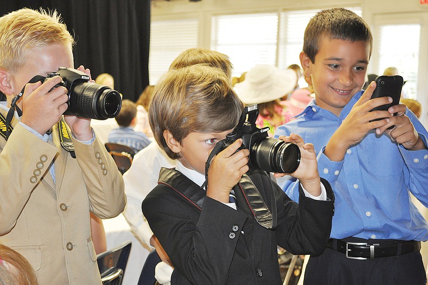 Ty Laird, Hayden Bizick and Grant Massey took photos of their moms at the May Out-of-Door Academyâ€™s Motherâ€™s Day Tea.