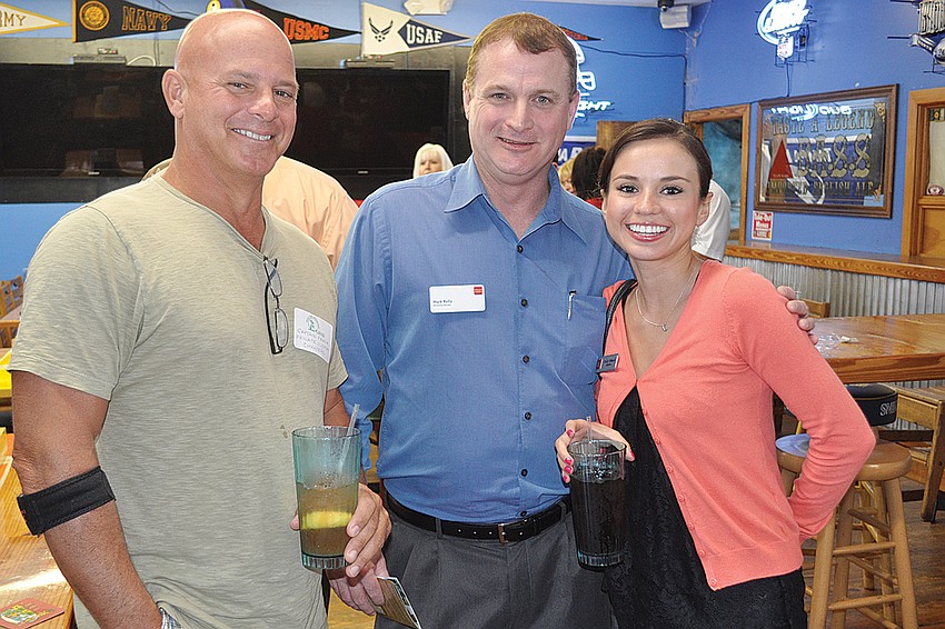 Capt. Frank Martinelli, Mark Kelly and Cindy Velasco.