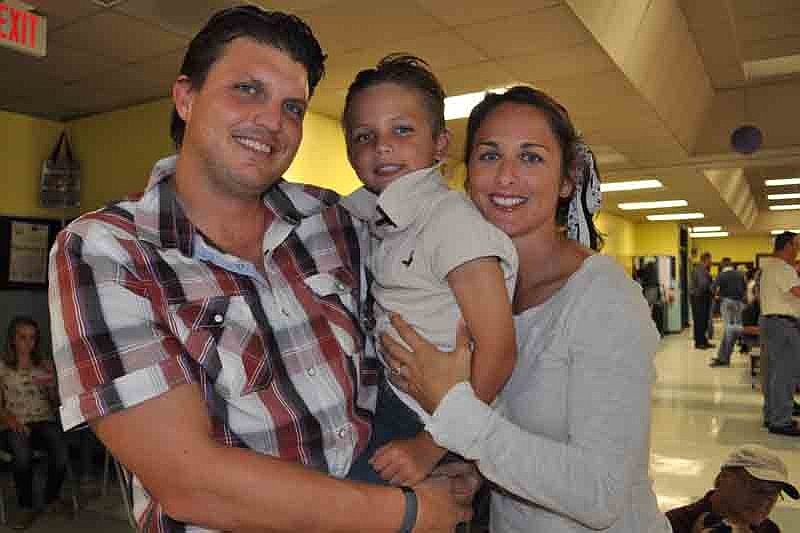 Andy and Jen Clark enjoyed the night with their son, Aaron, center.