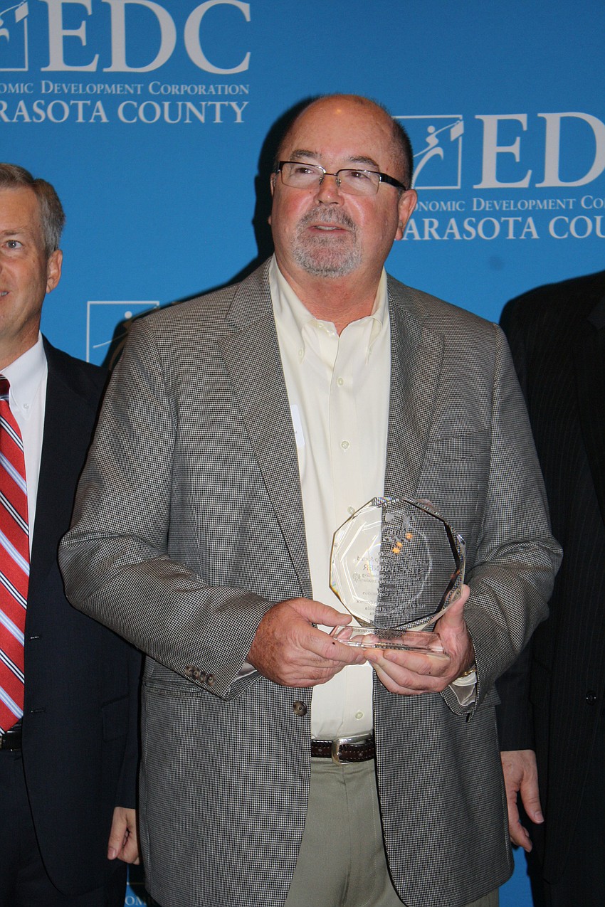 The Clyde Nixon Business Leadership Award was presented to Steve Harner owner of Crowâ€™s Nest. The award was presented by Chair of EDC David Sessions and President, CEO, Director of Sun Hydraulics Corporation Allen Carlson.