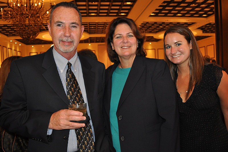 Bob Coates of North American Bancard with Rita Lowman and Lauren Boyle, both of Community Bank
