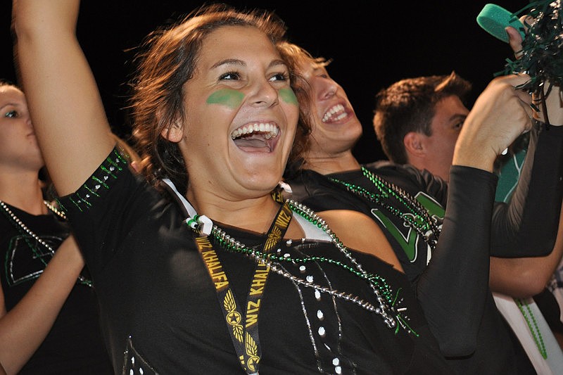 Seniors Julia Barrow and Zach Ange, behind, cheered continuously.