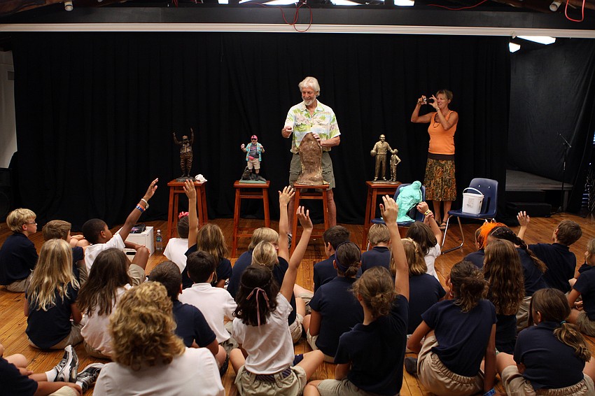 Art teacher Linda Wallin takes a photo of her class as they interact with artist Jack Dowd Thursday, Oct. 13 at ODA.