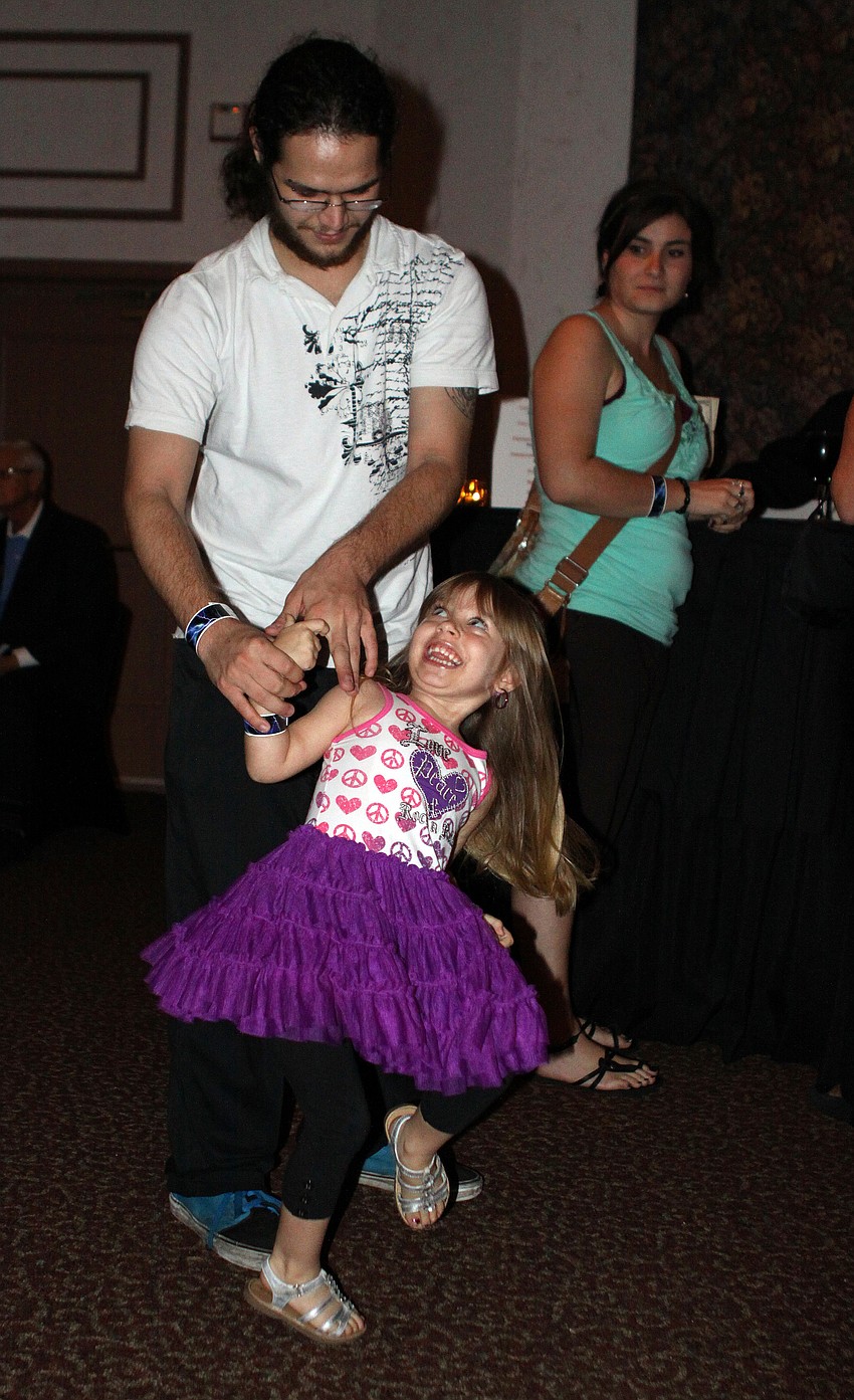 Alan Brayton spins his daughter, Chloe, 4.